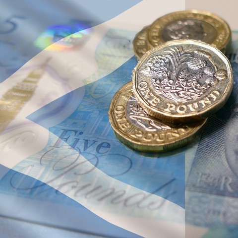coins and banknote with Scotland flag