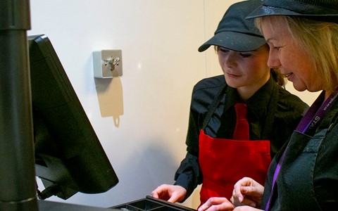 students working in a cafe