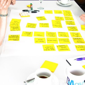 Post-it notes on a desk – in a meeting
