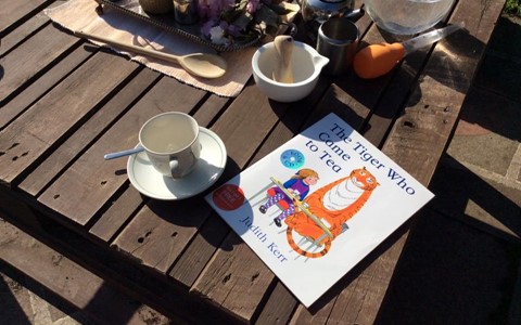 story book and tea cups
