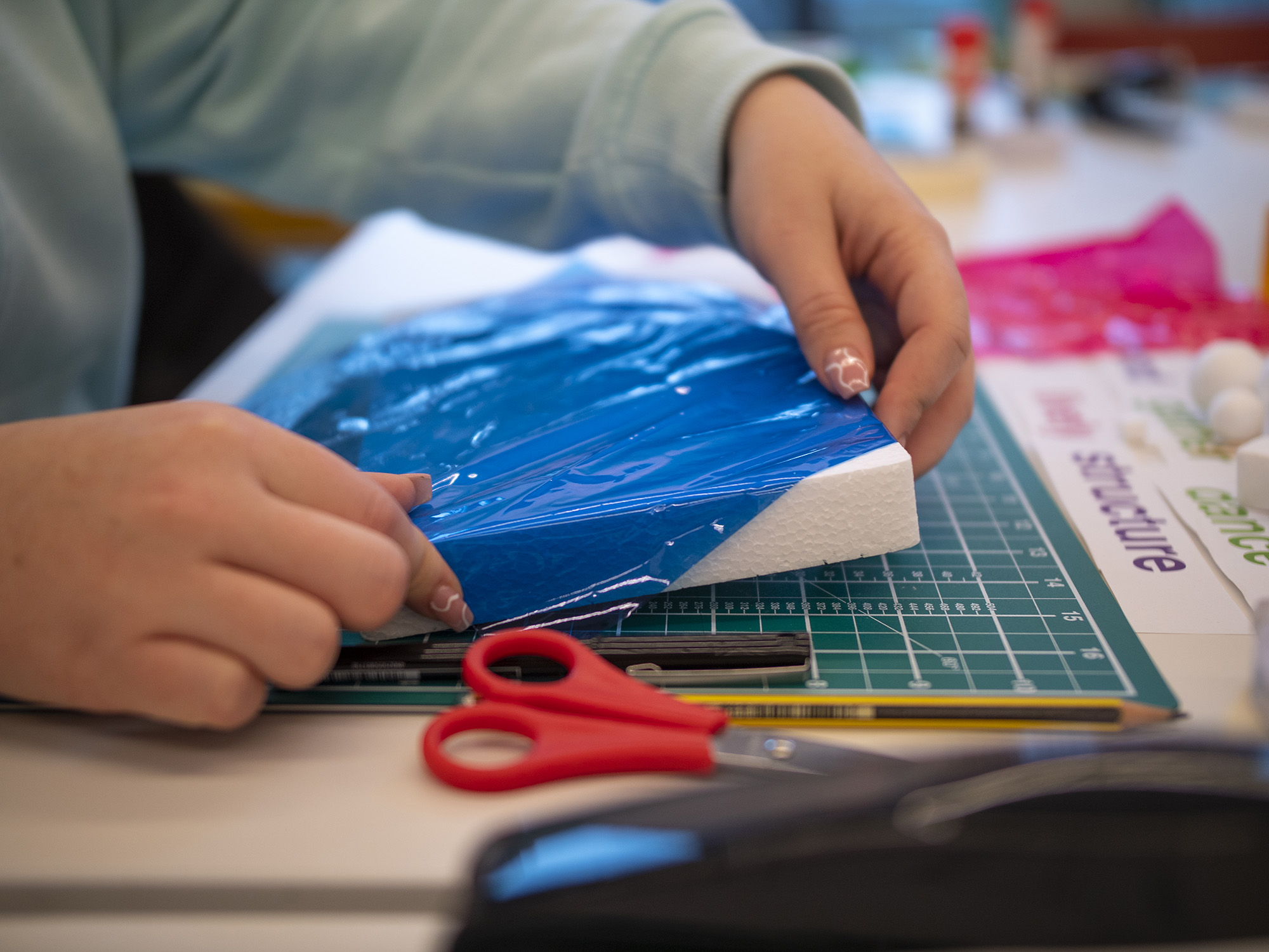 design student working with foam block