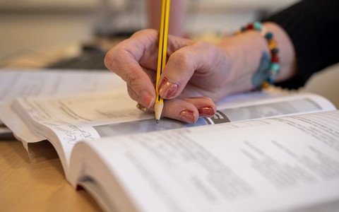 business student filling in paperwork