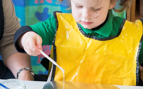 child playing in classroom