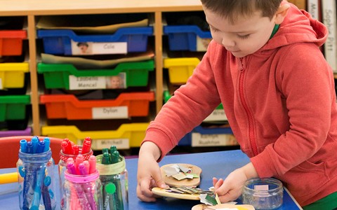 child playing in classroom