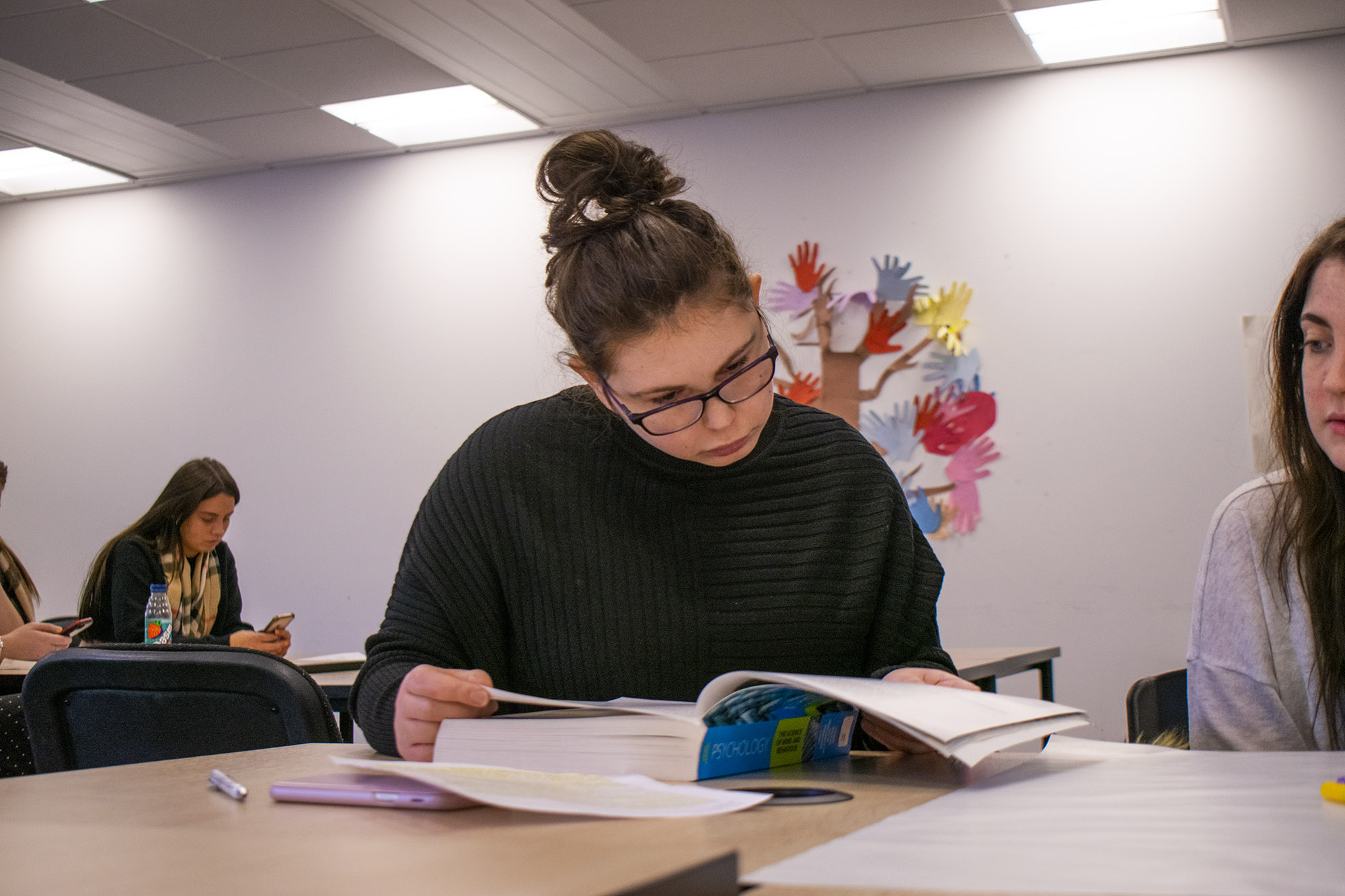 student reading at desk