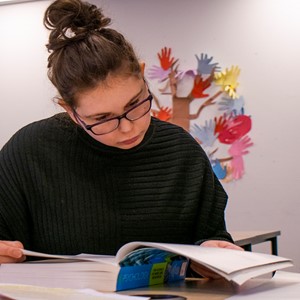 student reading at desk