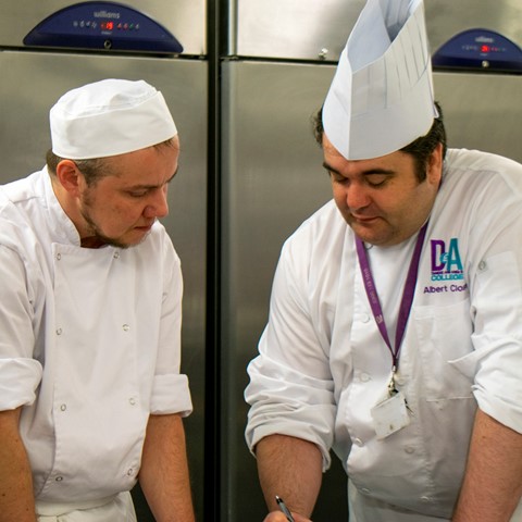 cookery students in kitchen