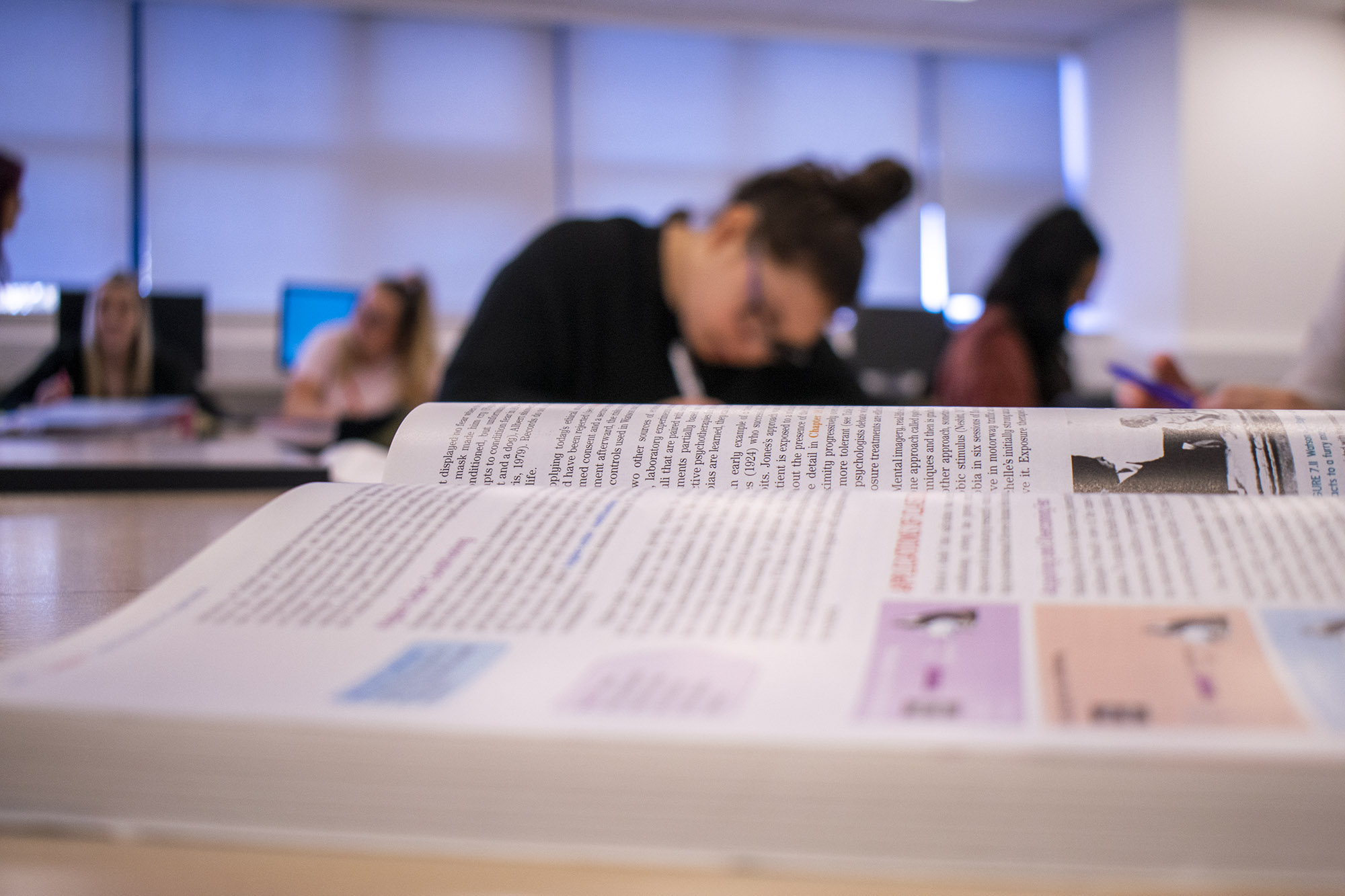 student writing in notepad