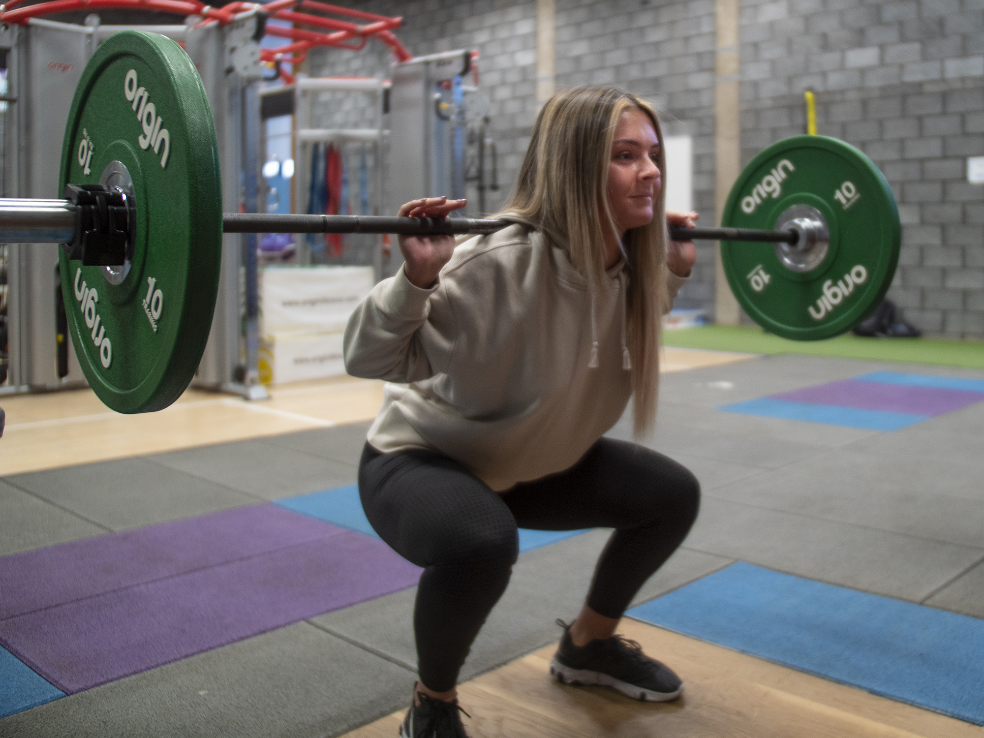 student lifting weights