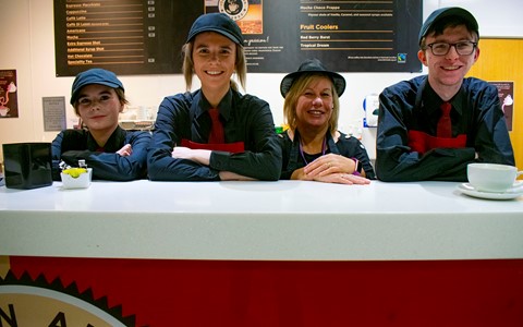 students working in a cafe