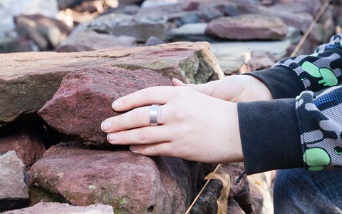 hands assembling a wall
