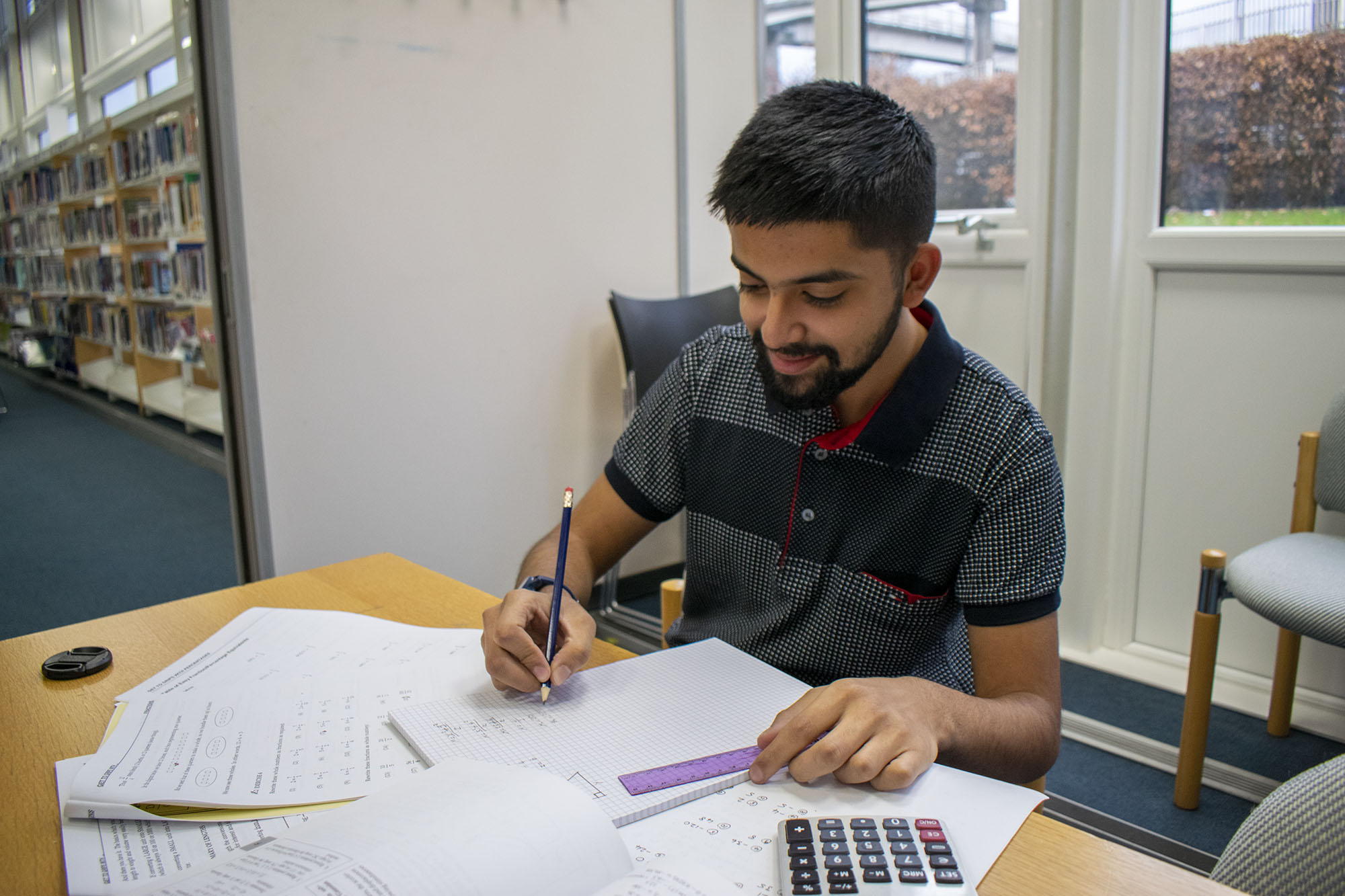 student working on maths questions