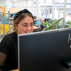 girl looking at computer screen