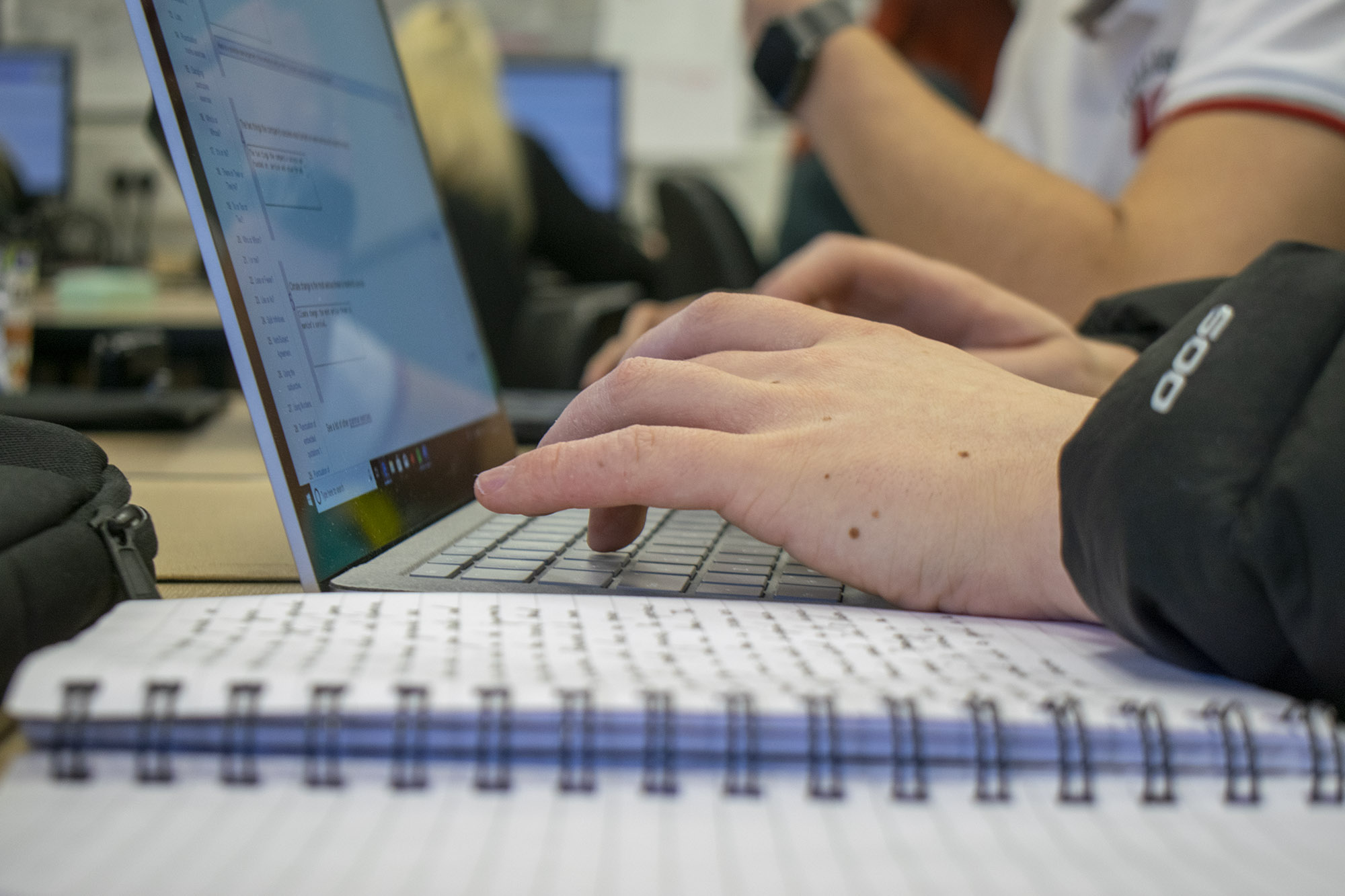 typing up notes to a laptop