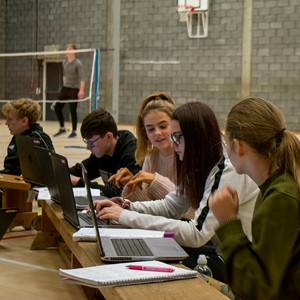 Students studying in a gym