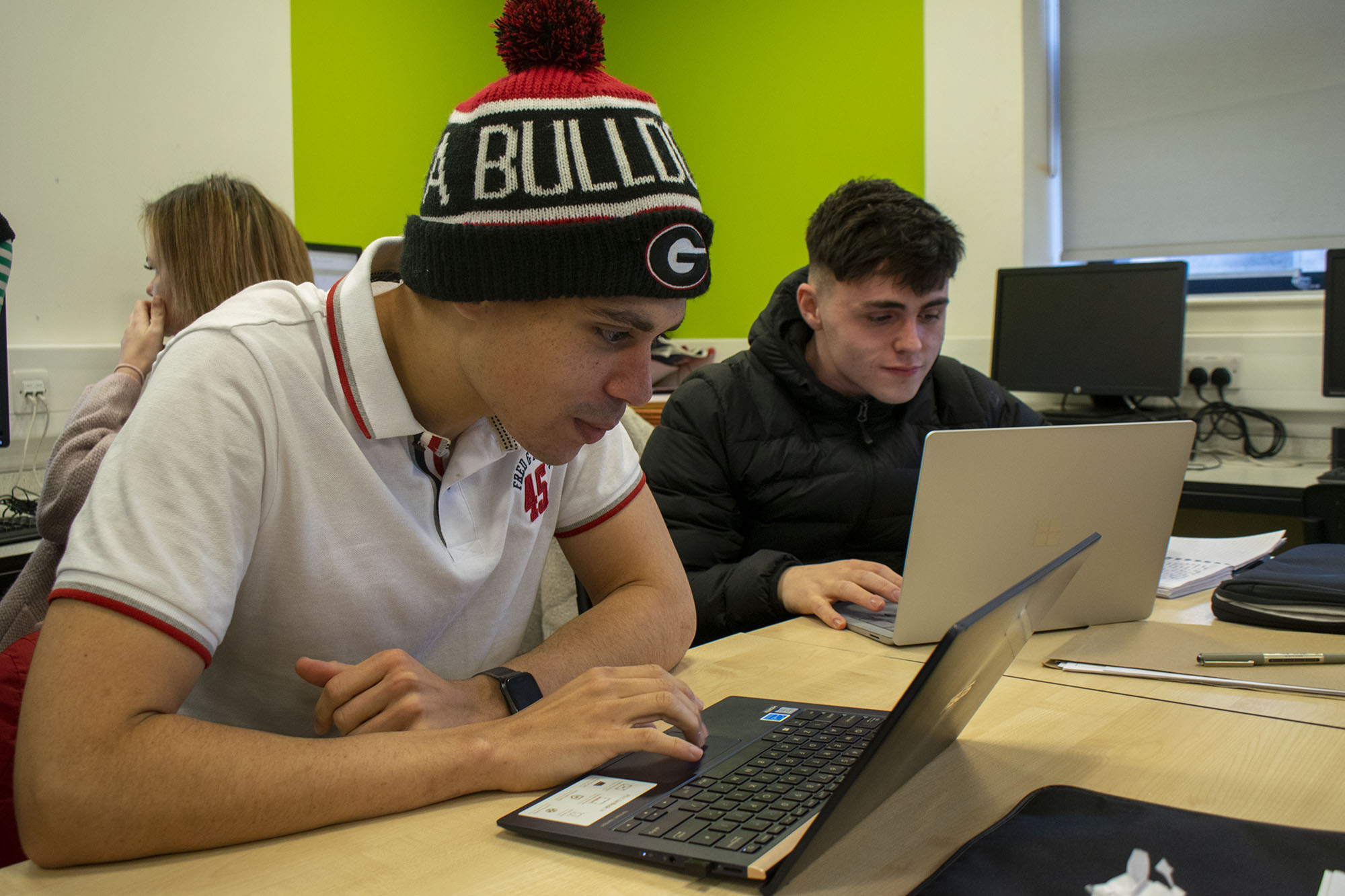 Students working at laptops