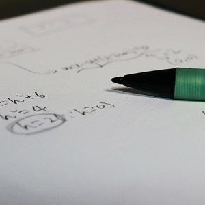 maths notes and a pen
