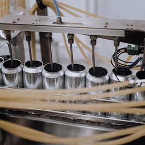 close up of cans being filled
