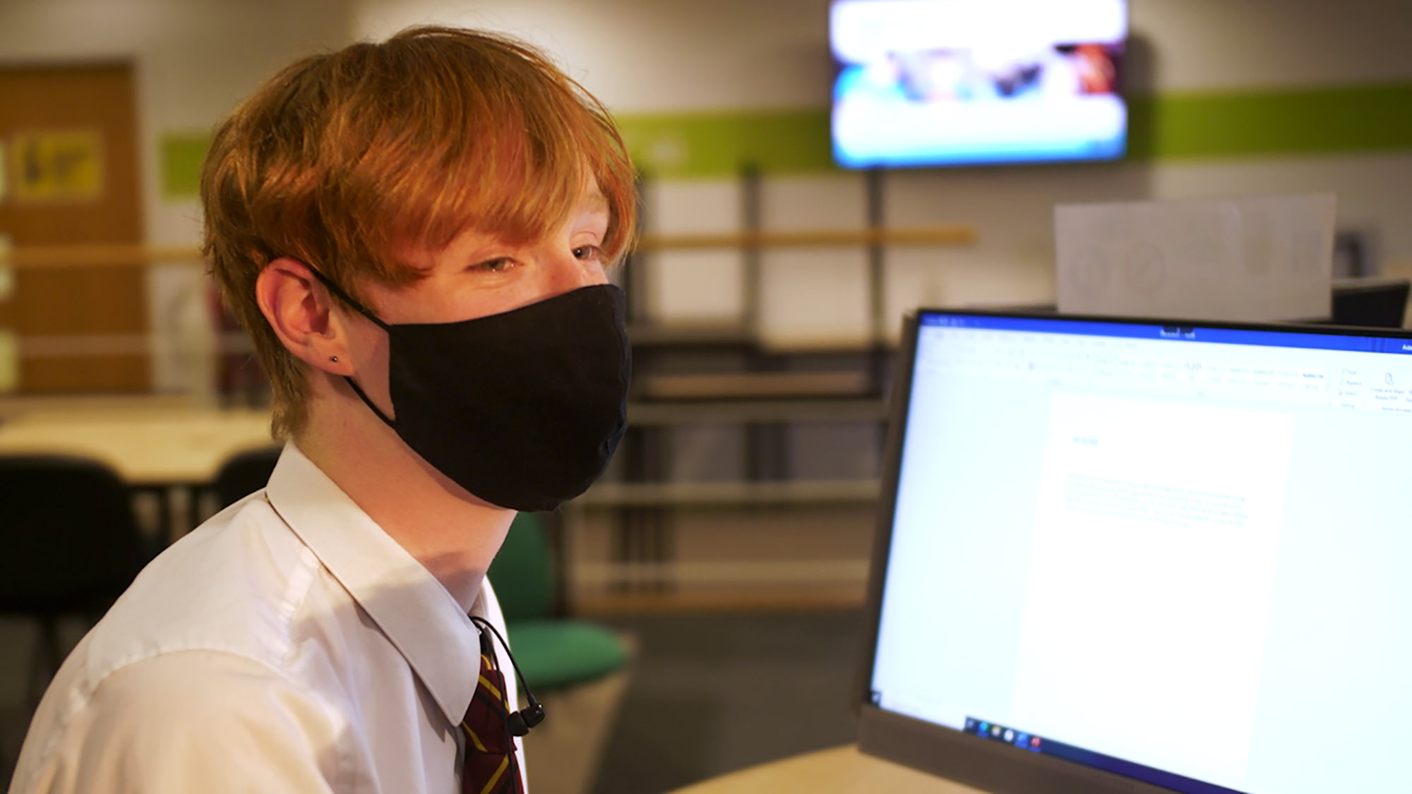 School pupil at computer in college