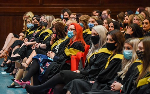 graduates sitting in Caird Hall