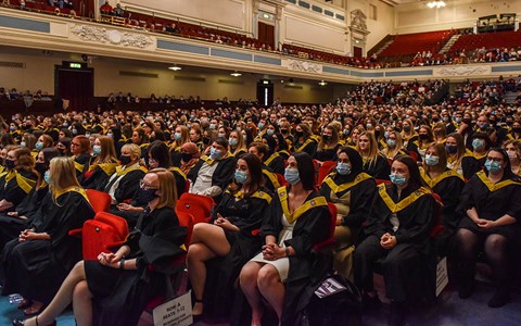 graduates sitting in Caird Hall