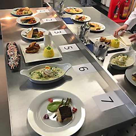 plates of food layed out for rating in competition
