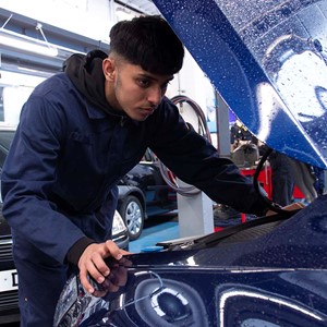 automotive technician working on car