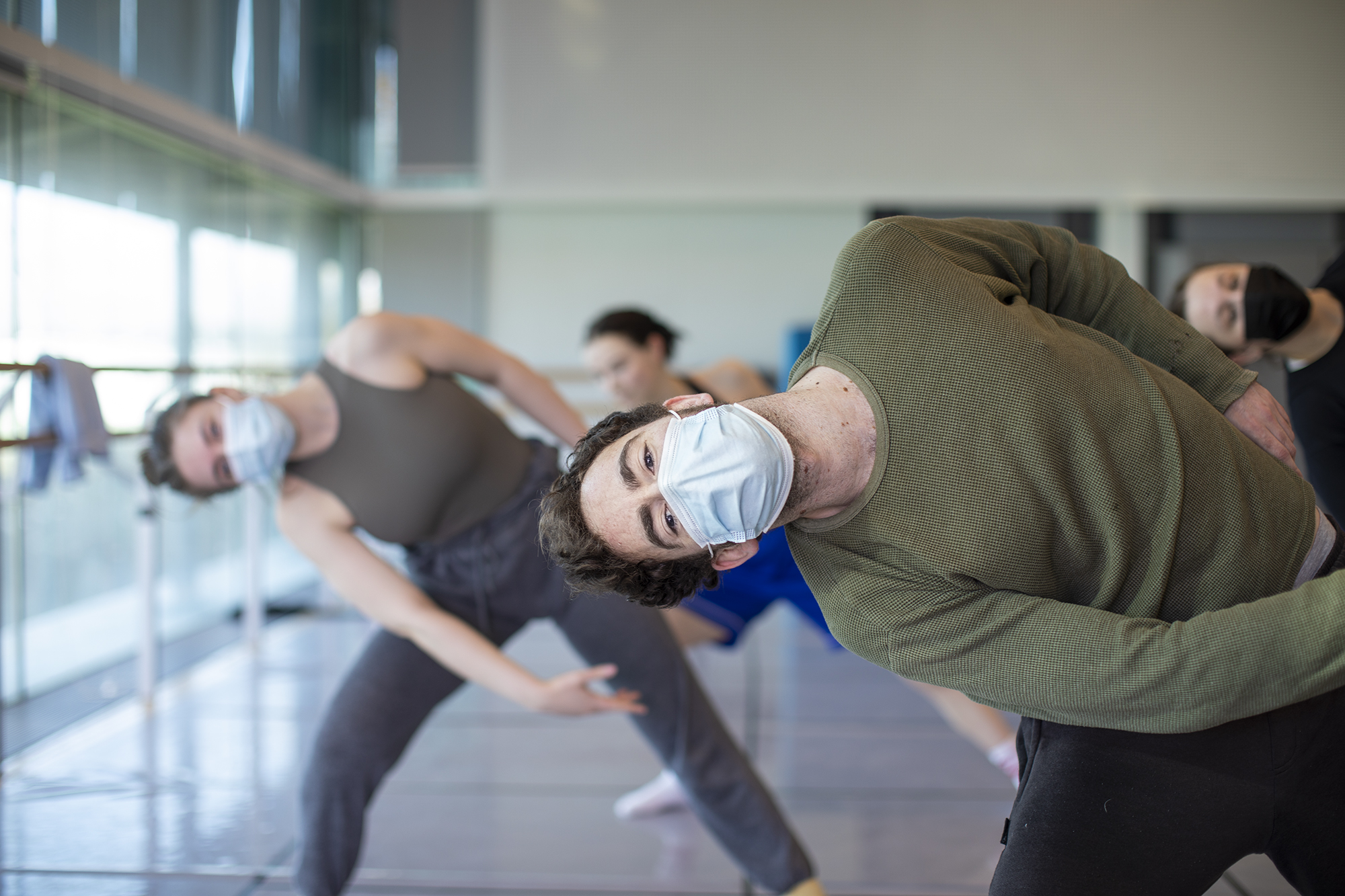 dance lecturer leading class in some dynamic dance moves