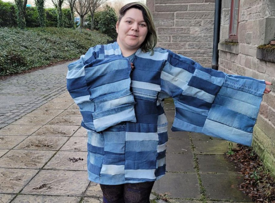 Textiles Student wearing reclaimed Denim dress on display at the V&A