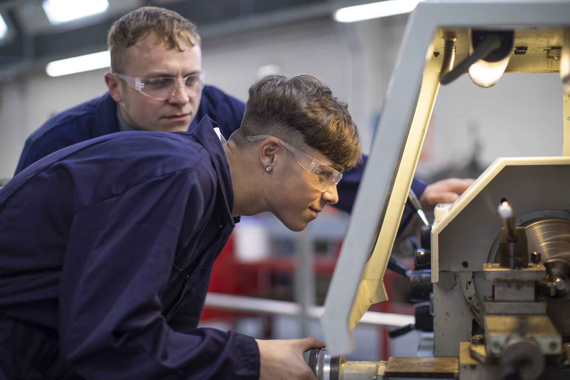 Manufacturing Academy student using Lathe
