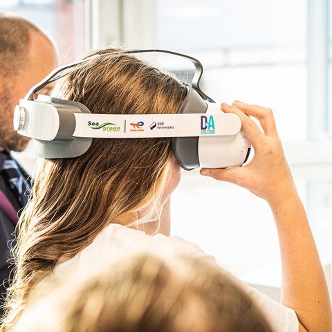 Children trying on VR Headsets