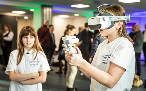 Children trying on VR Headsets