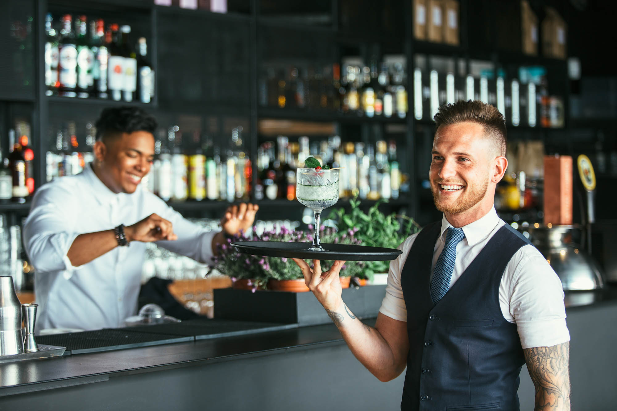 smiling staff in a bar