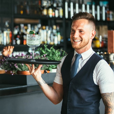 smiling staff in a bar