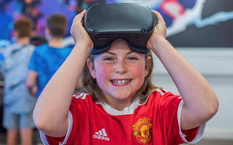 Girl posing with VR headset