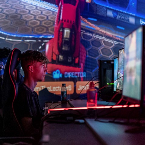 Student focused on E-Sports tournament game