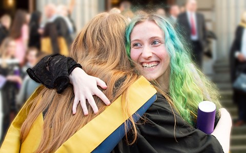 graduating student celebrating