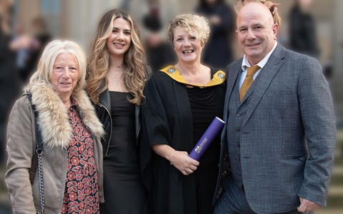 graduating student celebrating