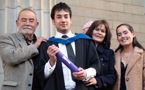 graduating student celebrating