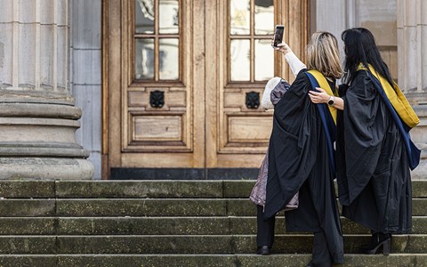 graduating students taking a selfie