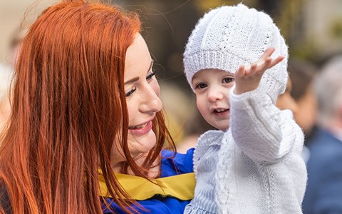 graduating student with baby