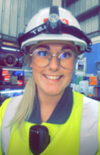 Girl with high vis uniform and hard hat on