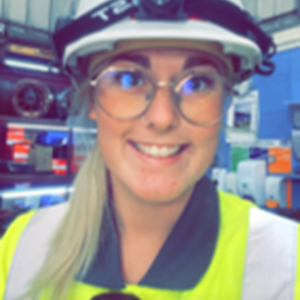 Girl with high vis uniform and hard hat on