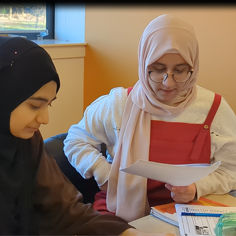 Two ESOL students working together