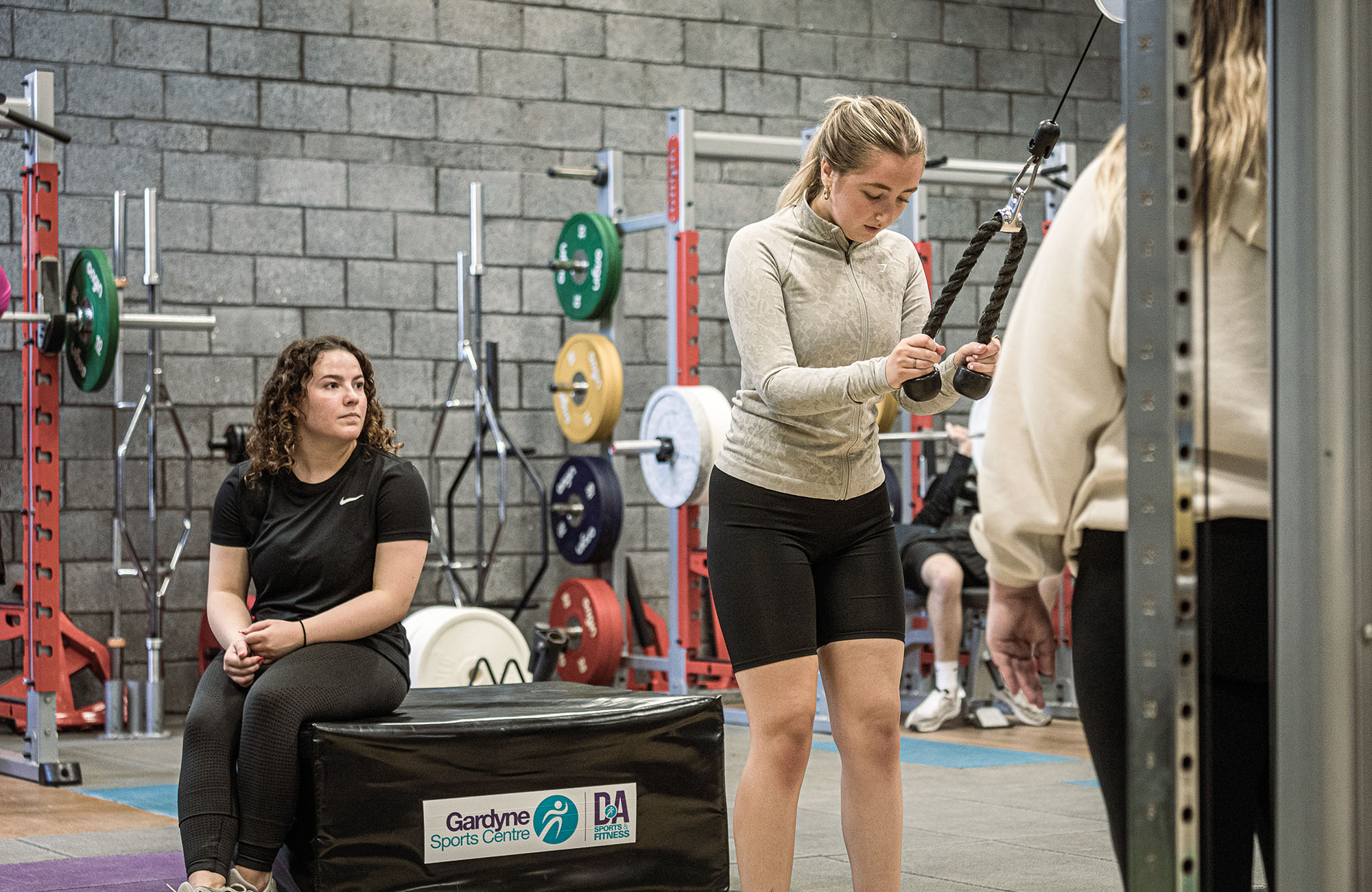 Sports student using gym equipment