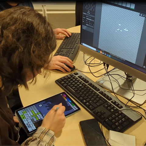 Student creating animation for game