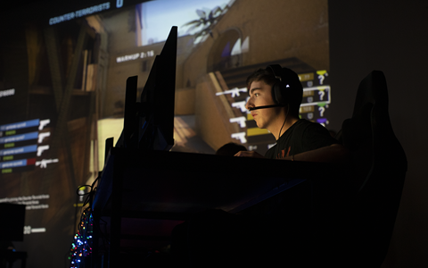 Student playing game as part of Esports tournament