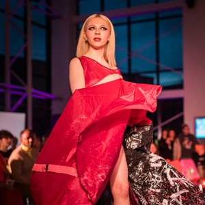Model walking catwalk in fashion show