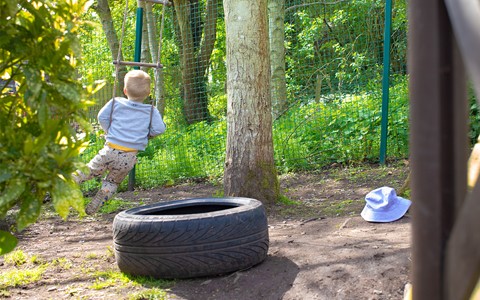 Helping Hands Nursery Child on Swing