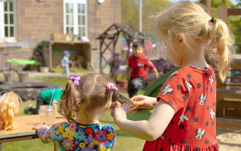 Helping Hands Nursery Girls Playing with Hair